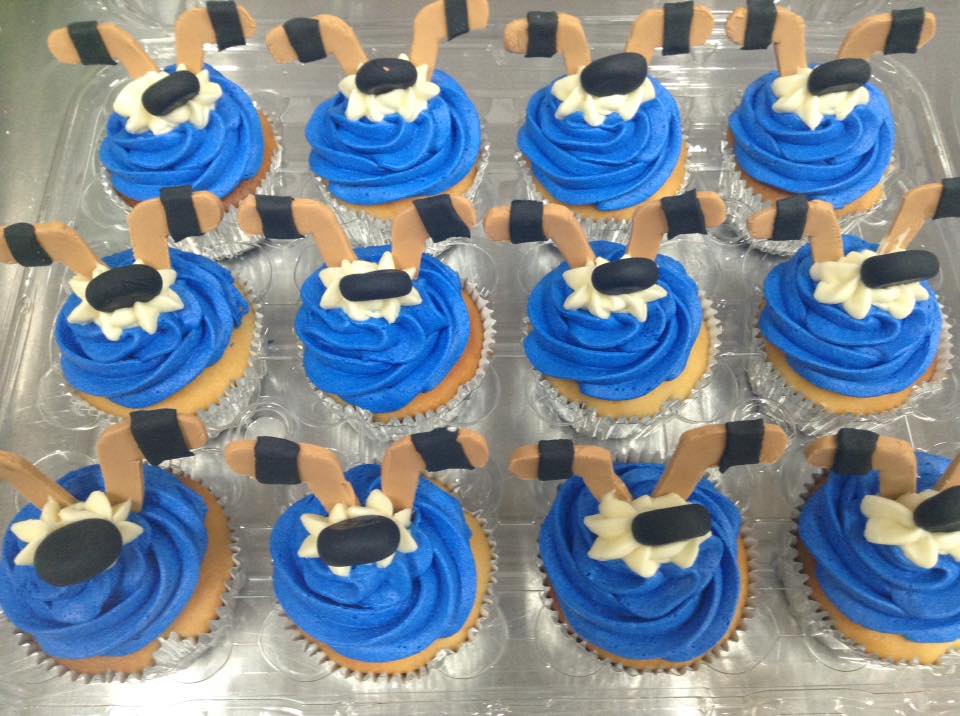 Hockey Stick & Puck Cupcakes by om Eat My Sweets Bakery