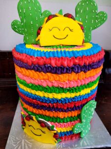 Tall rainbow desert themed birthday cake